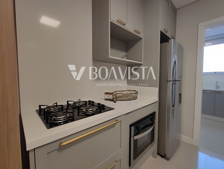 Apartamento novo mobiliado com 2 suites na Av. principal de